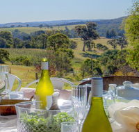 The Farmhouse - grape vines and rolling green hills - NT Tourism