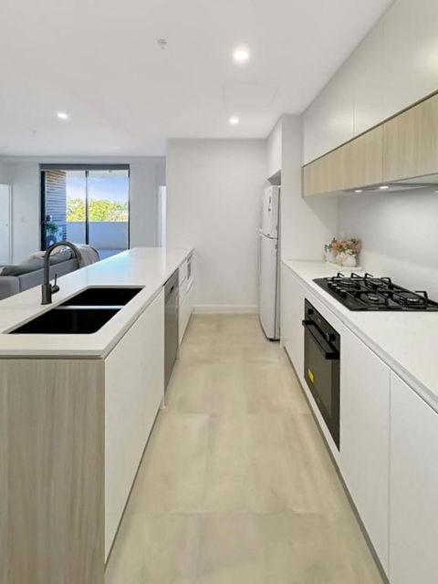 Modern 2BR Suite With Balcony & Parking Near Airport - NT Tourism 1